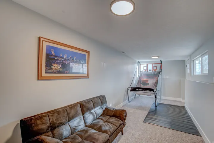 Recessed windows with trim, light gray painted walls, and light gray carpet