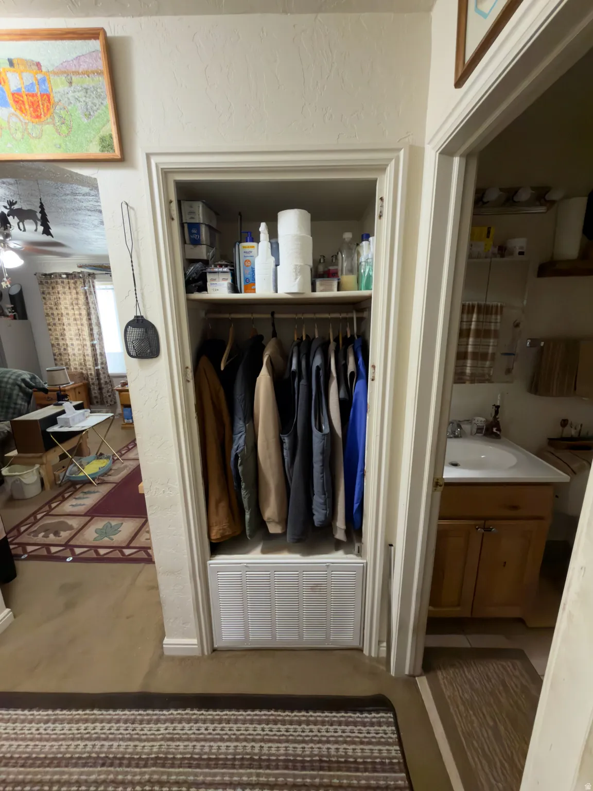 Recessed closet with built-in shelving and hanging rod