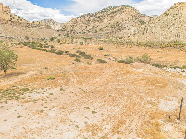 Expansive land parcel featuring desert landscaping and mountainous terrain