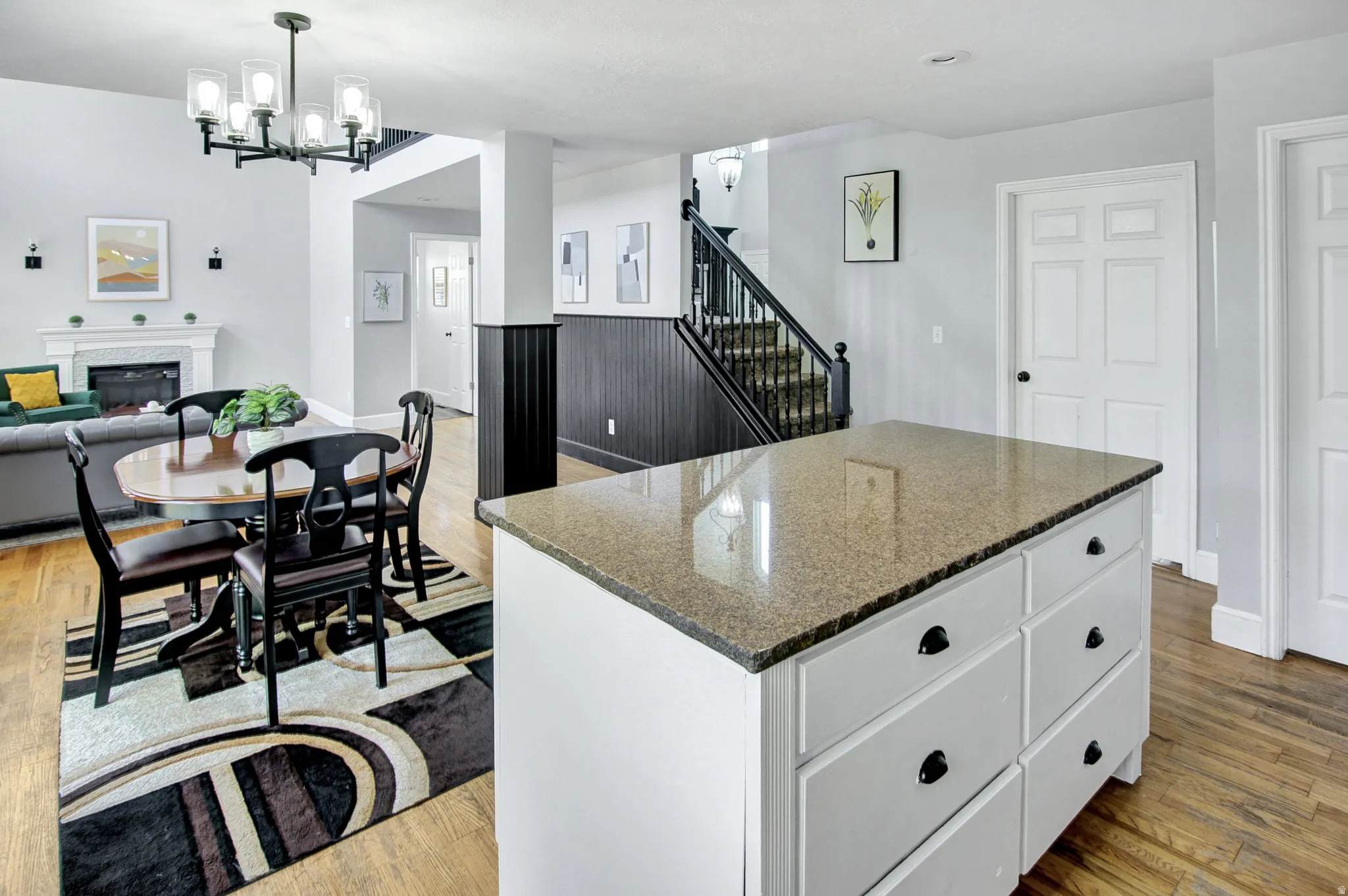 Kitchen island with a granite-style countertop and ample storage