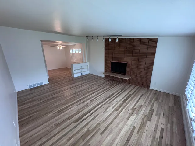 Hard Wood-finish flooring throughout living room dining room and kitchen.