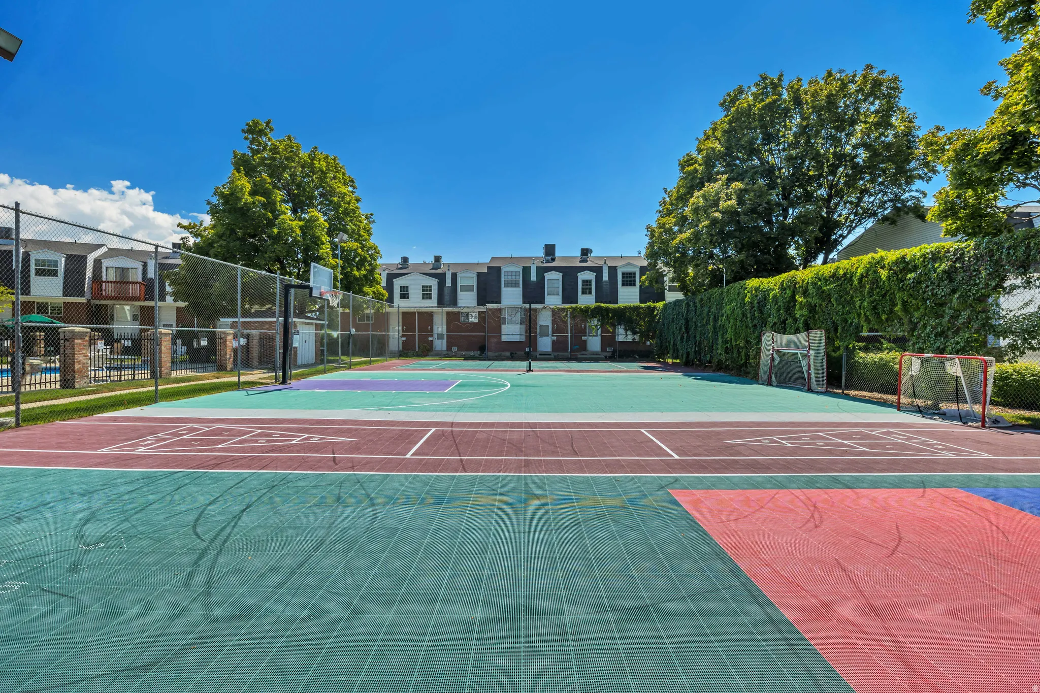 Multi-sport court featuring a basketball hoop