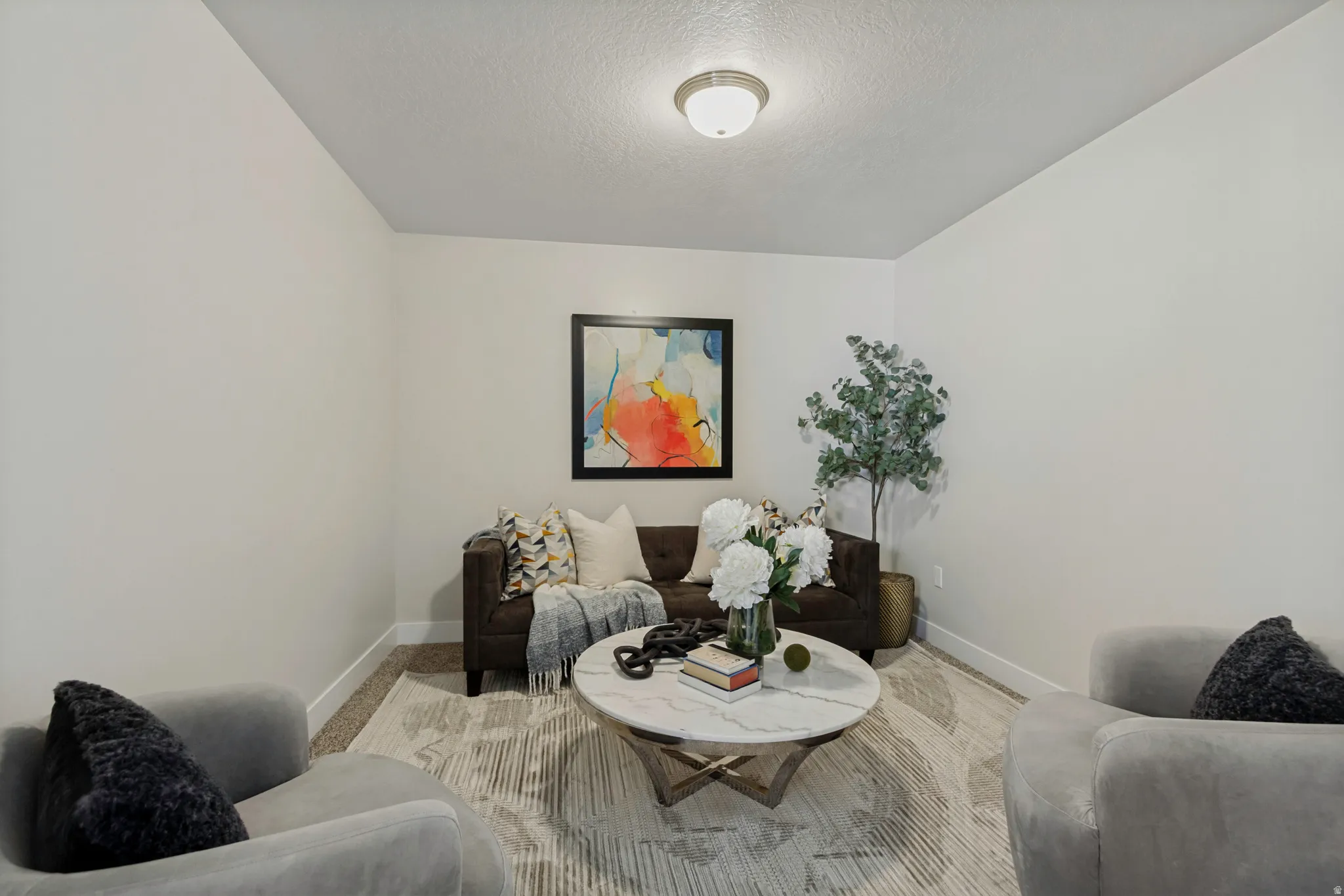 Recessed ceiling light fixture and neutral wall finishes create a bright atmosphere