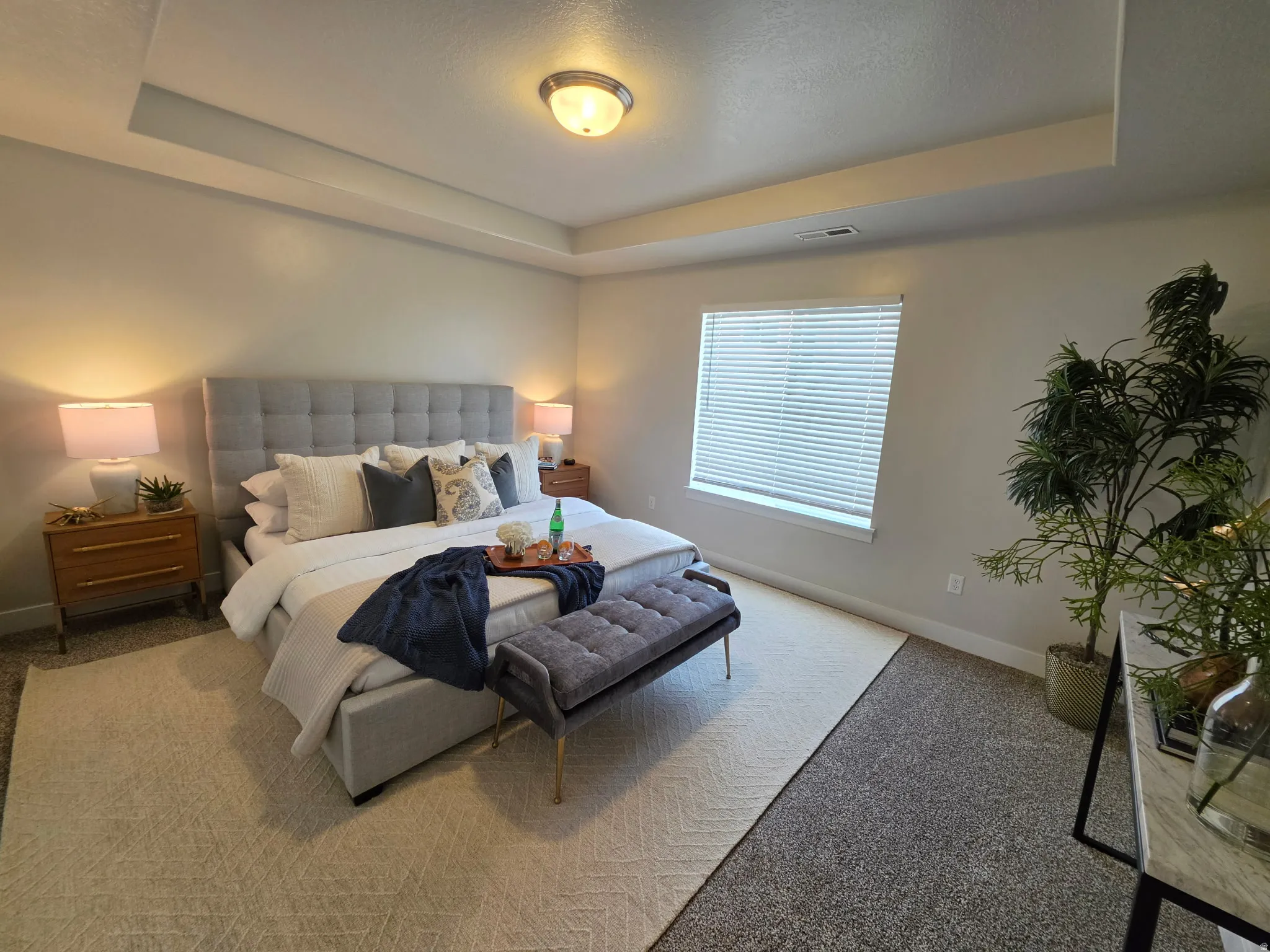 Recessed ceiling with central flush mount lighting
