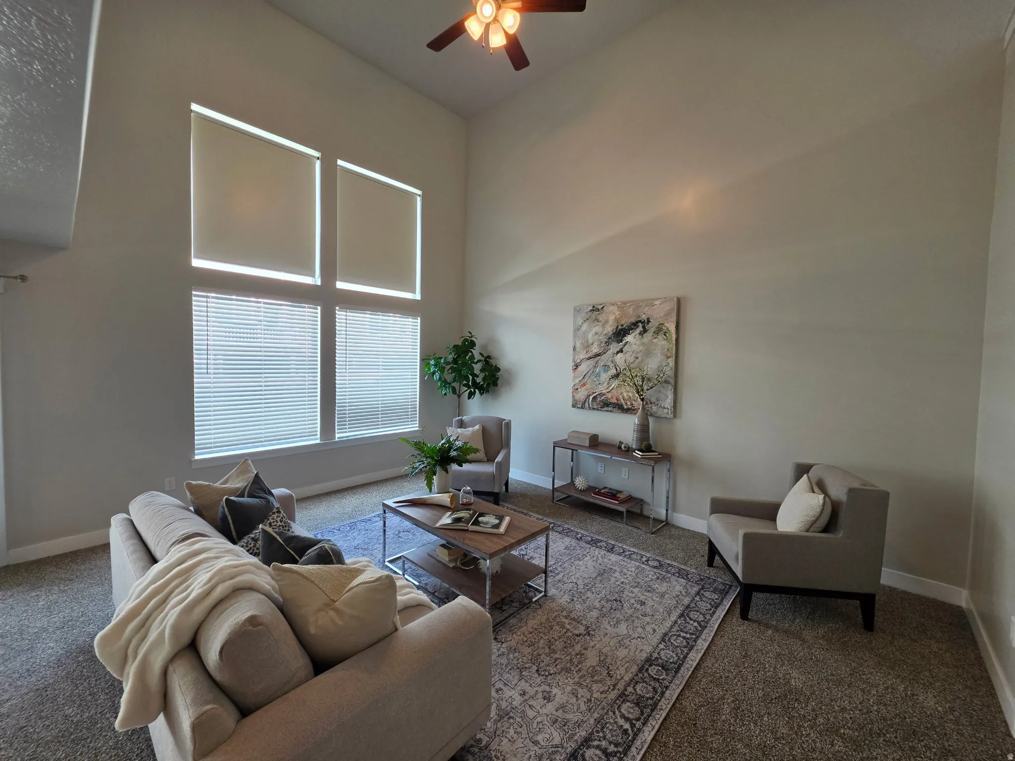 Soaring vaulted ceiling with wood-finish ceiling fan