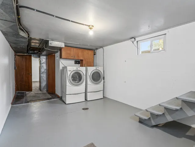 Duet Whirplool washer and dryer stay, Large laundry room with epoxy floors