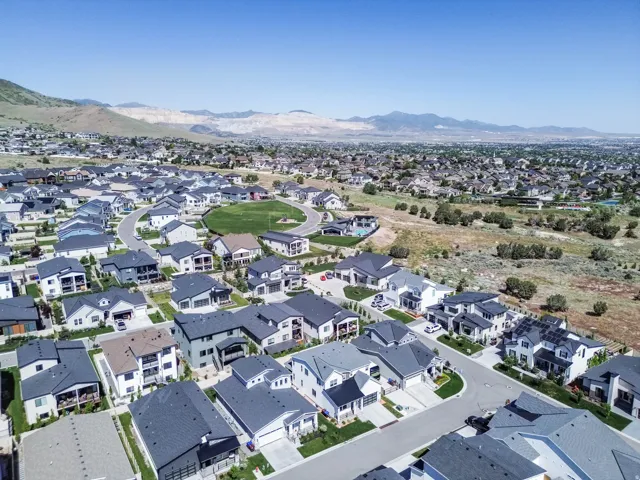 Residential development featuring varied architectural styles and dark-pitched roofs