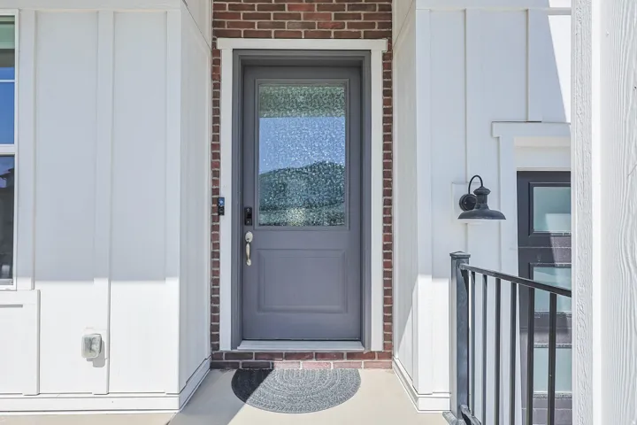 Board and batten siding with brick accents