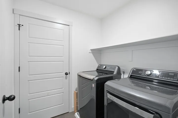 White paneled door with black hardware
