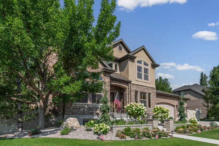 Stone and stucco exterior with arched entry