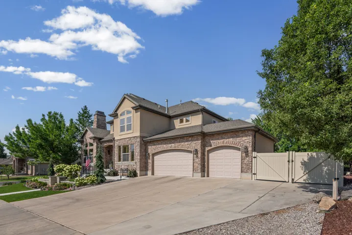 Stone and stucco exterior with multiple gables