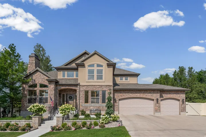 Stately brick and stucco exterior with multiple gables