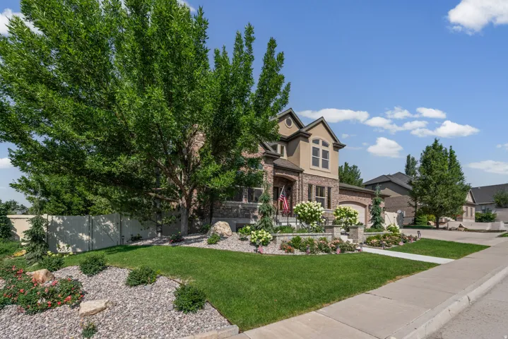 Stucco and stone exterior with architectural gables
