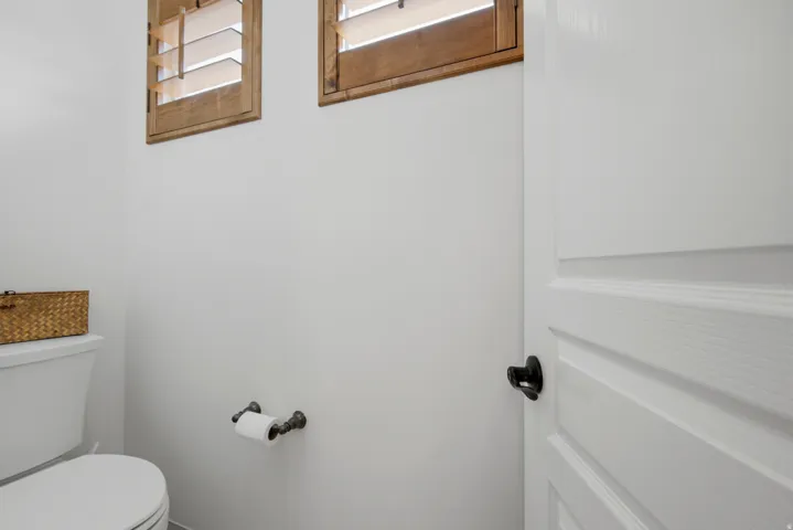 White paneled door with matte black hardware