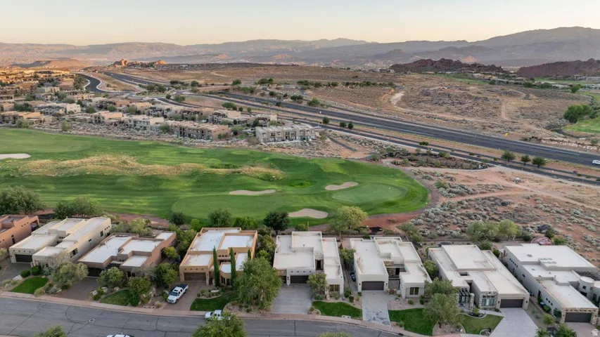 Aerial perspective showcasing modern residential properties and a manicured golf course