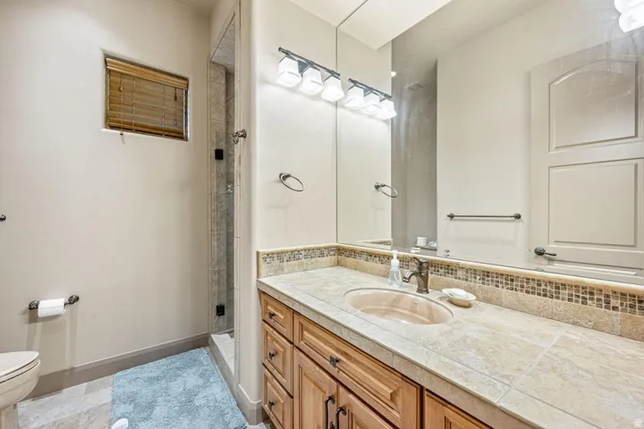 Tiled countertop with integrated sink and mosaic backsplash