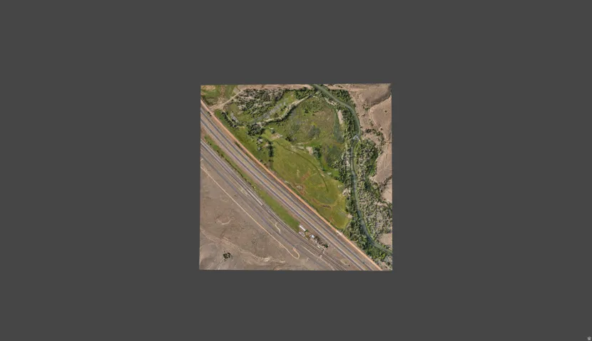 Aerial Survey. Presenting an overhead perspective of the property, including transportation infrastructure and natural features