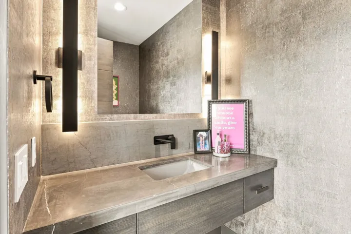 Floating vanity with integrated rectangular sink and wall-mounted faucet