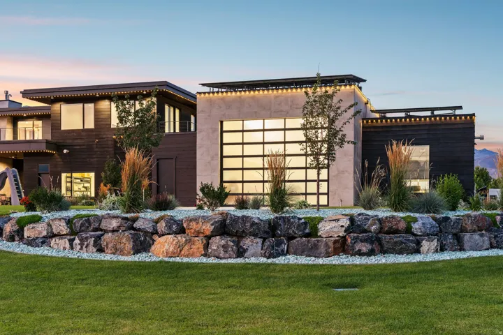 Modern exterior architecture with dark wood siding and concrete-finish accents