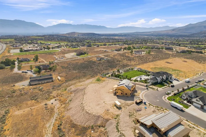 Aerial view showcasing a modern residence on expansive grounds