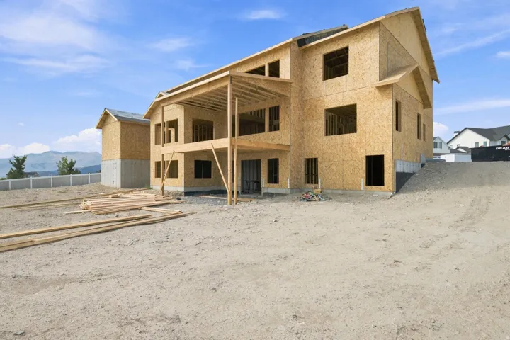 Back of house with walkout basement & covered deck