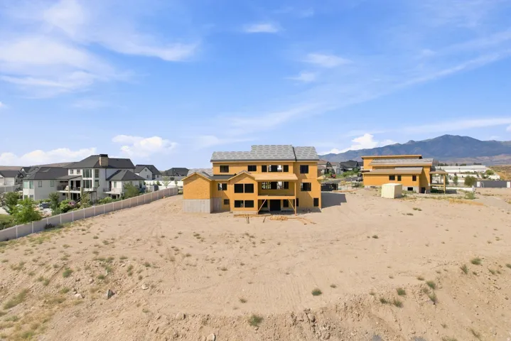 Back of house with walkout basement & covered deck