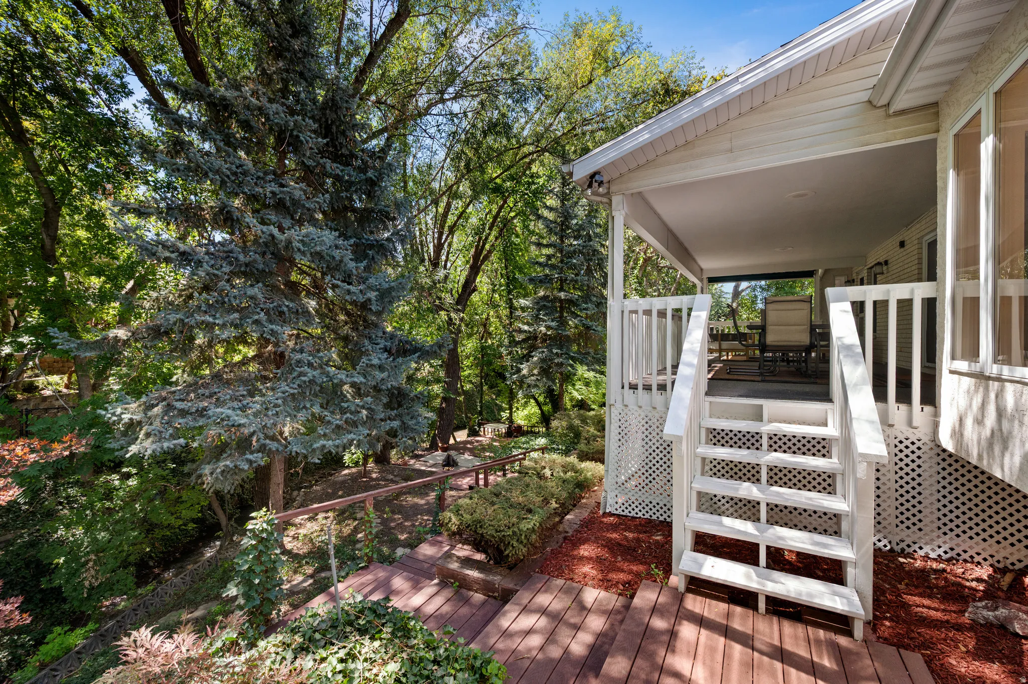 Towering mature trees create an exceptionally private and peaceful setting.