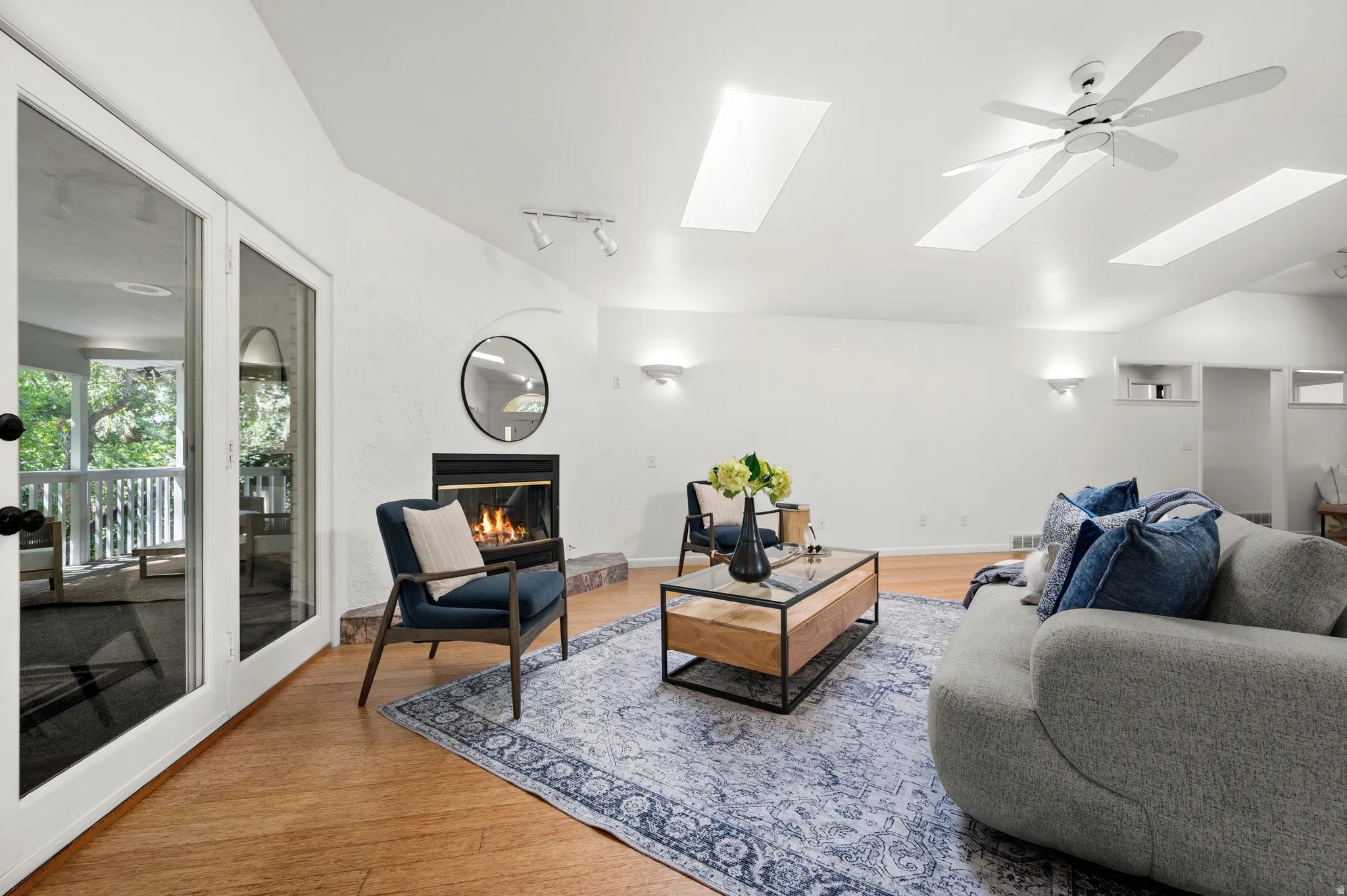 Expansive main-level living with vaulted ceilings, bamboo floors and easy access to the covered porch.