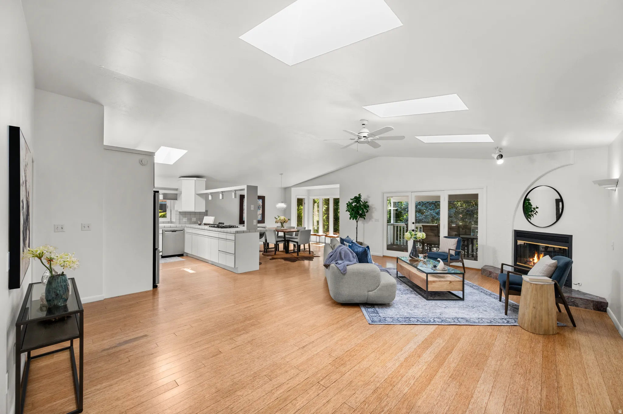 Vaulted ceilings, skylights and an open floor plan create a spacious, light-filled main living area.