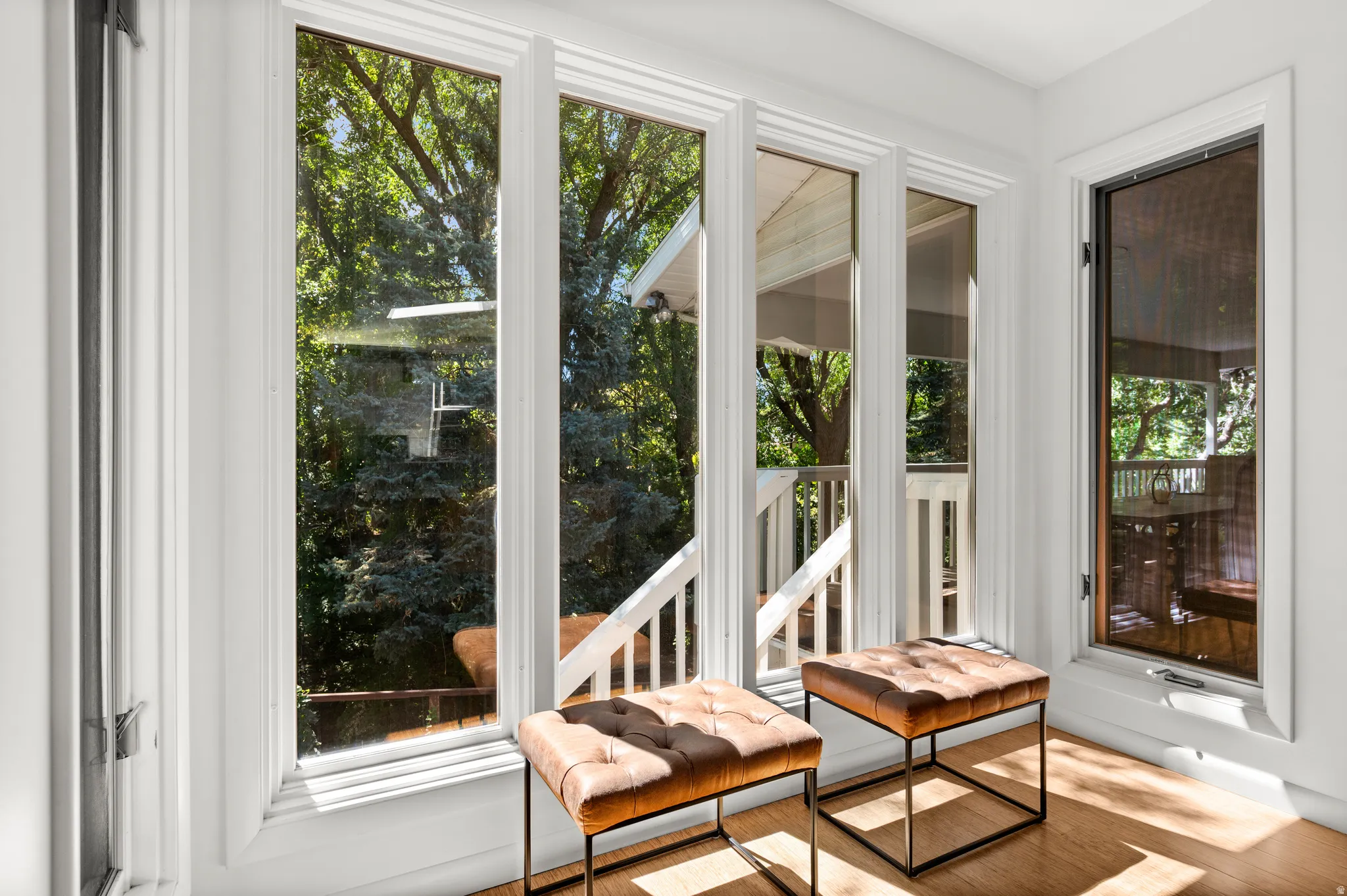 A quiet window-lined nook captures the home's wonderful connection to its wooded surroundings.