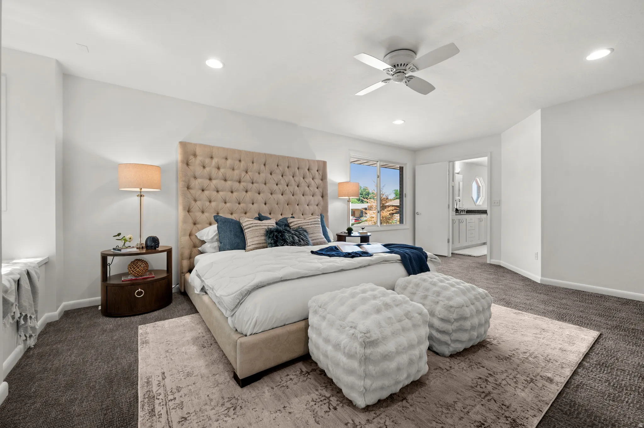 Another view of the primary suite shows its generous scale and convenient access to the adjoining bath.