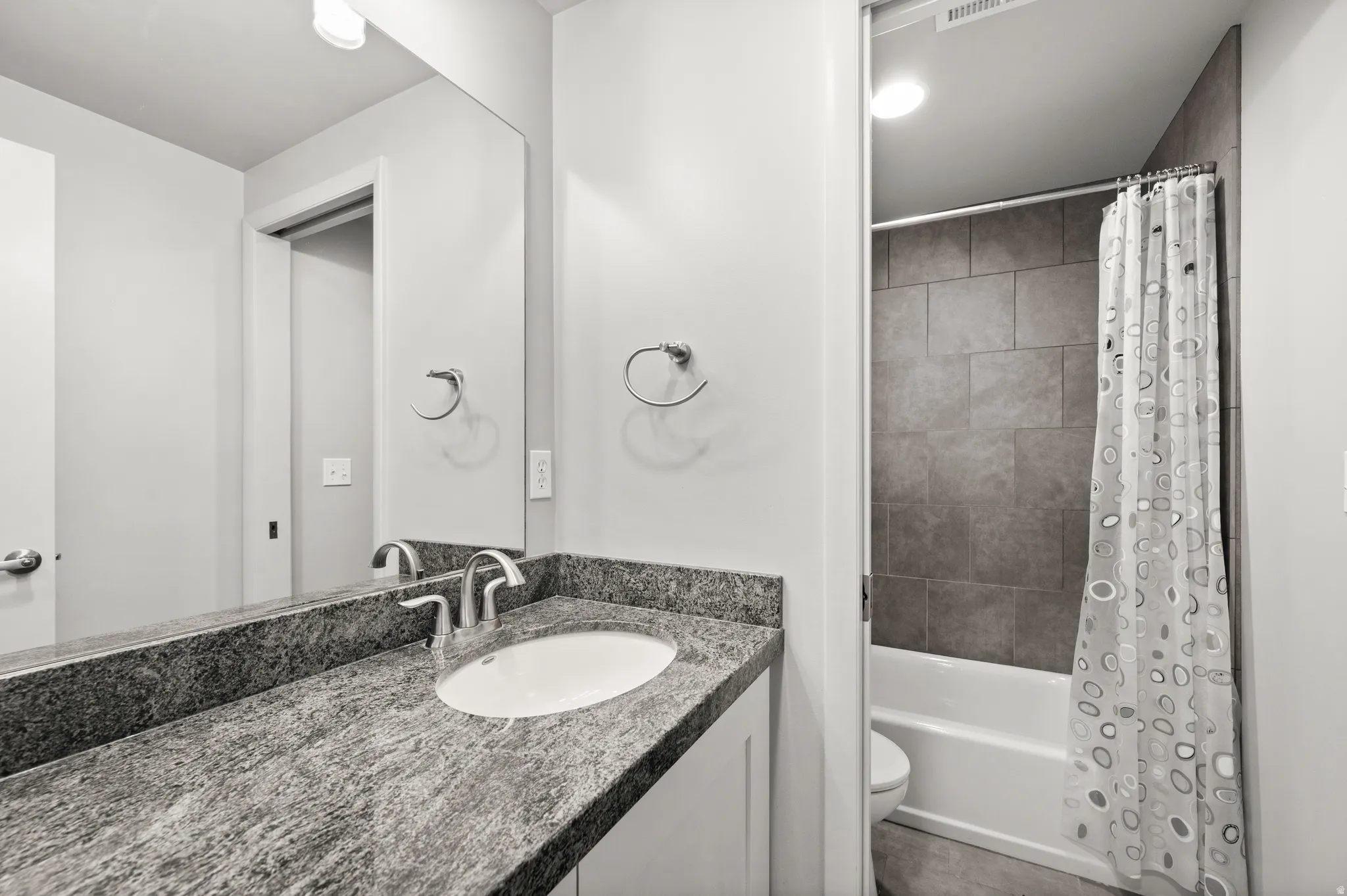 A full lower-level bath conveniently serves the additional living and bedroom spaces.