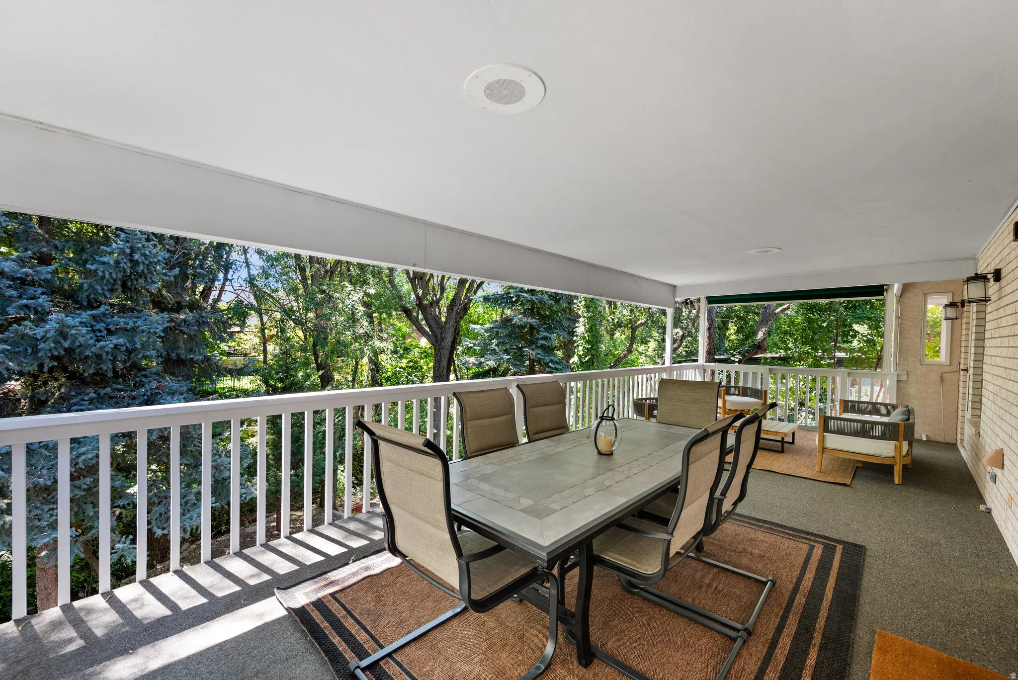 Generous enough for both lounging and dining, the covered porch feels like a natural extension of the home.