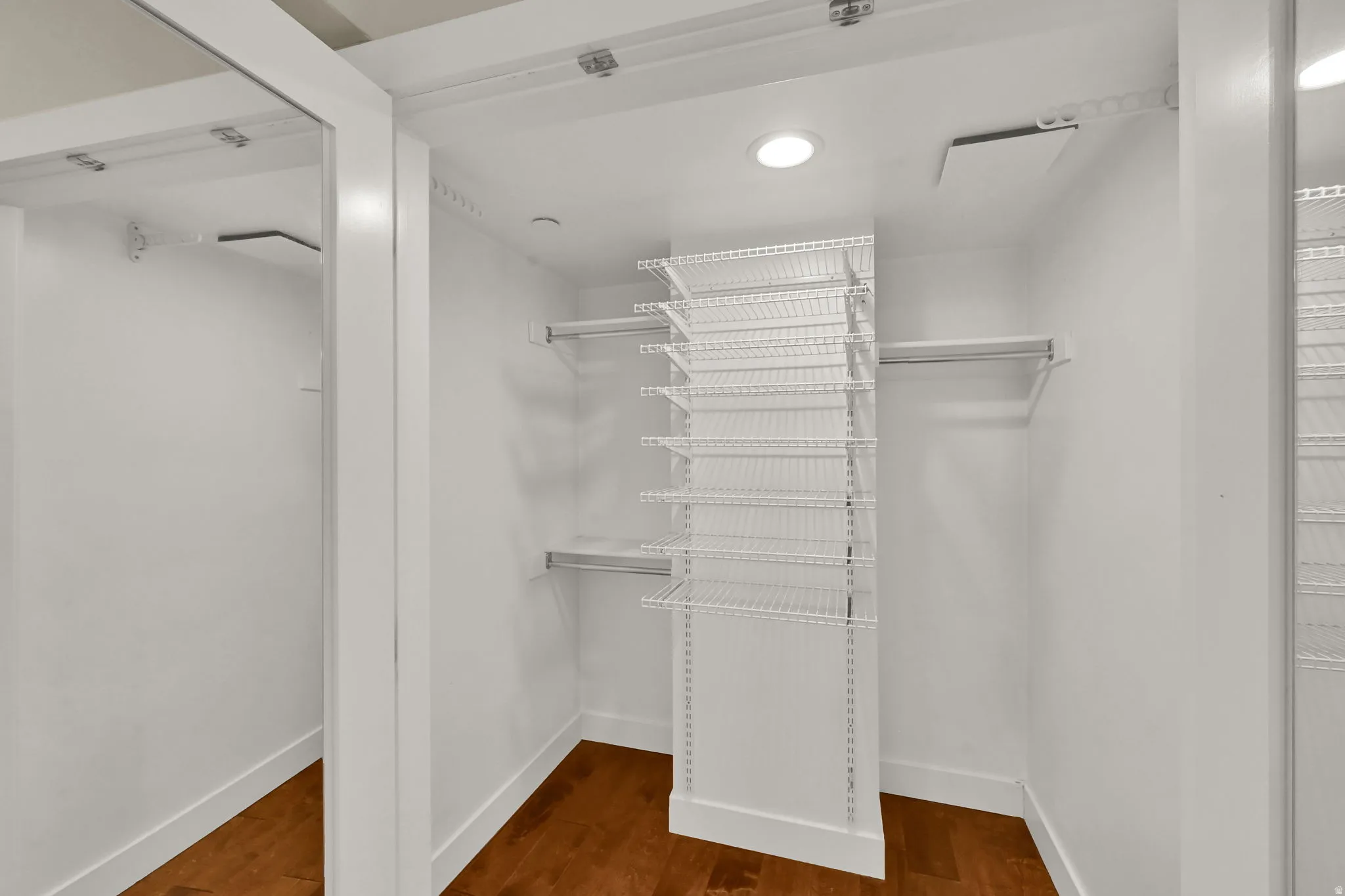 Primary bedroom walk-in closet