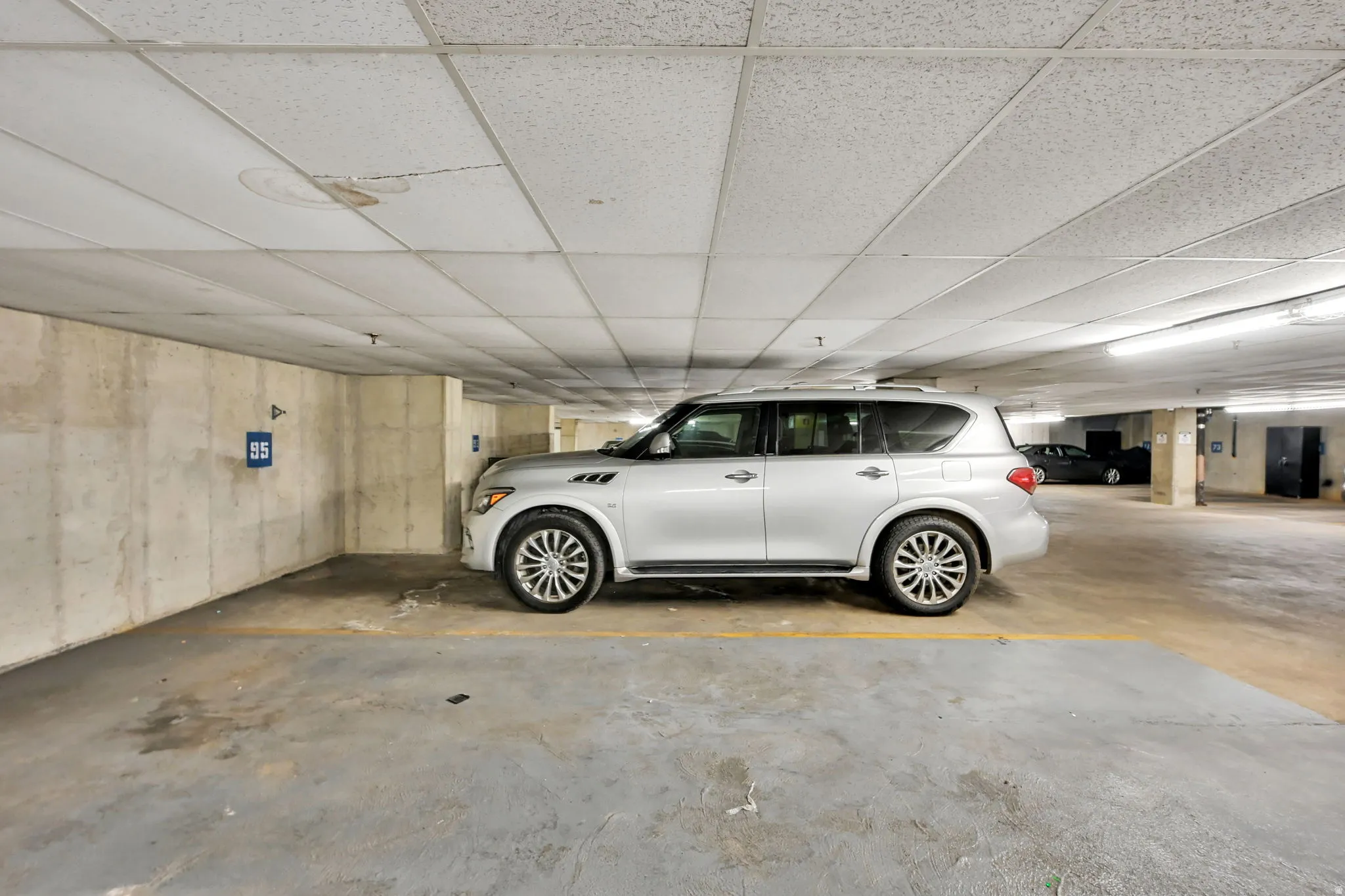 Extra long parking space with room for storage closet, motorcycle or bicycles.