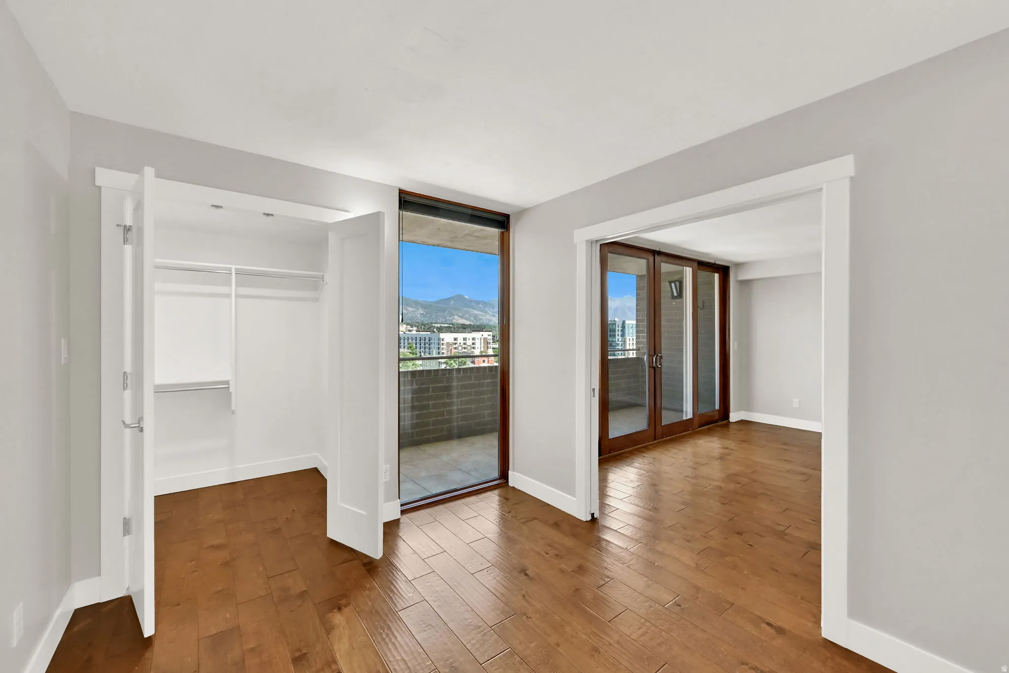 Secondary bedroom with walk-in closet and pocket doors