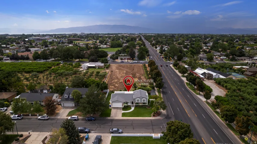 Well-maintained front lawn, paved driveway, mature trees, single-story residence, and a two-car garage