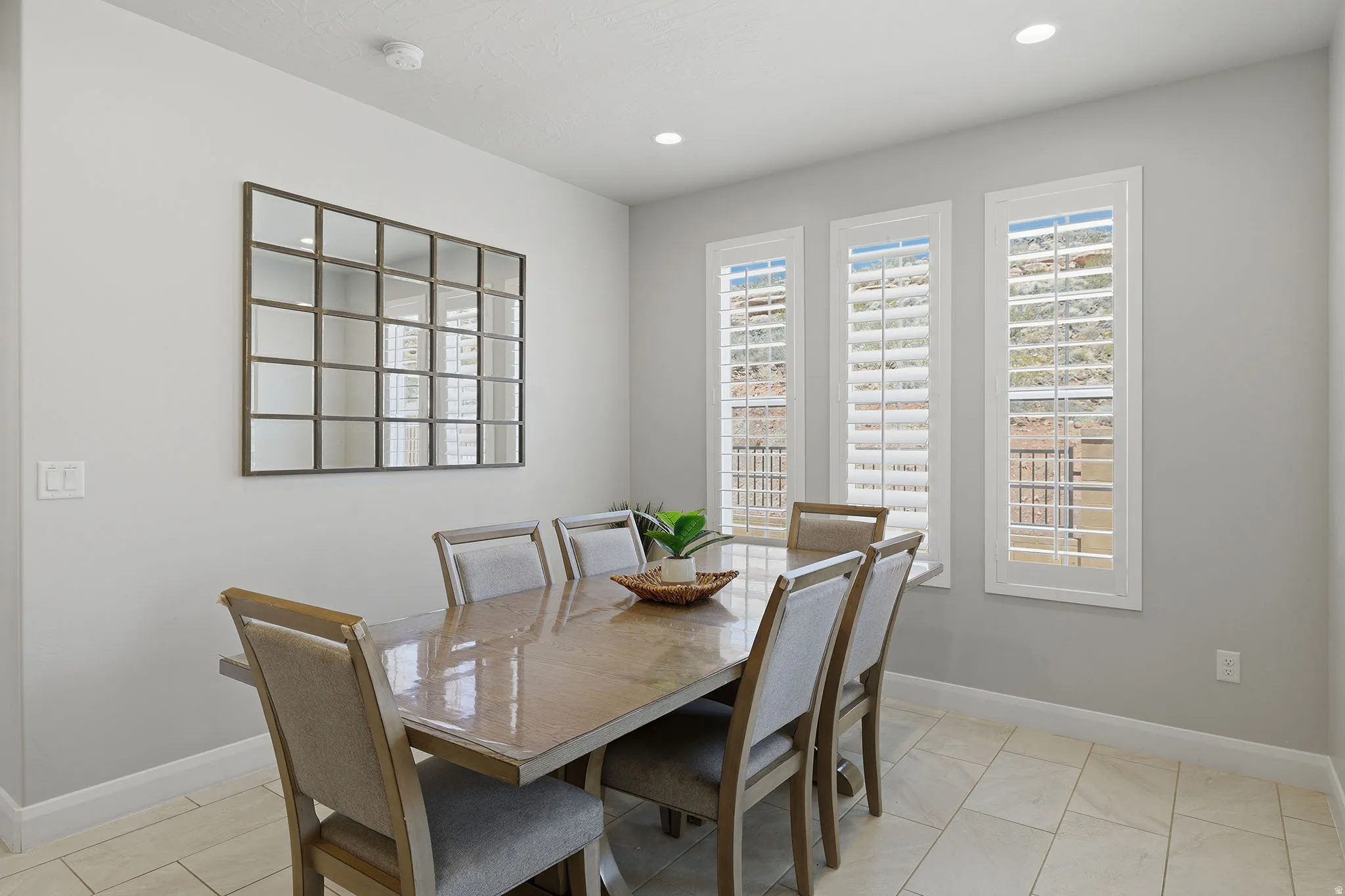Recessed lighting illuminates neutral-toned walls