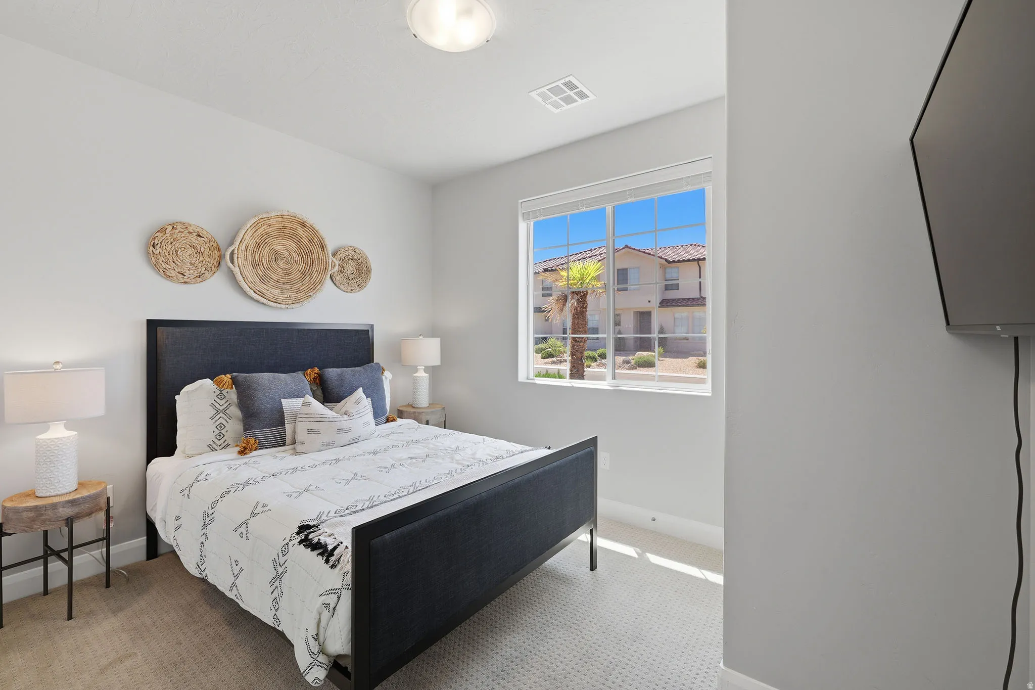 Recessed lighting, carpeted flooring, large window, and light-colored walls