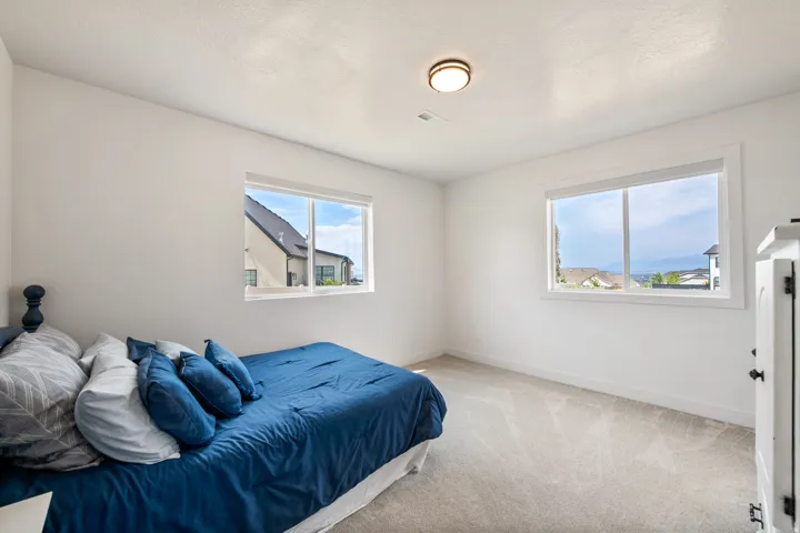 Bright interior with light-toned carpeting and white walls