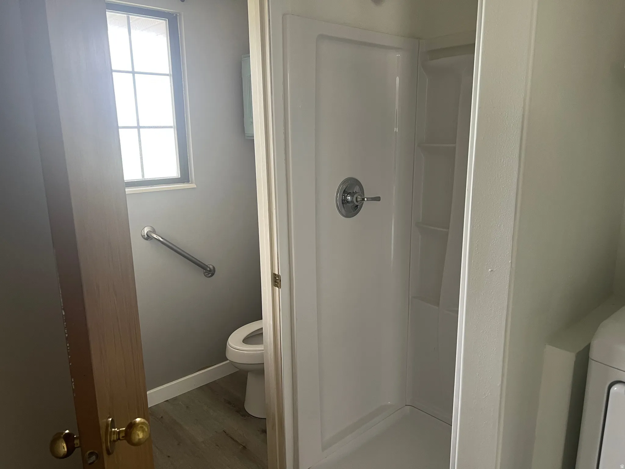 Built-in shower stall with chrome fixtures