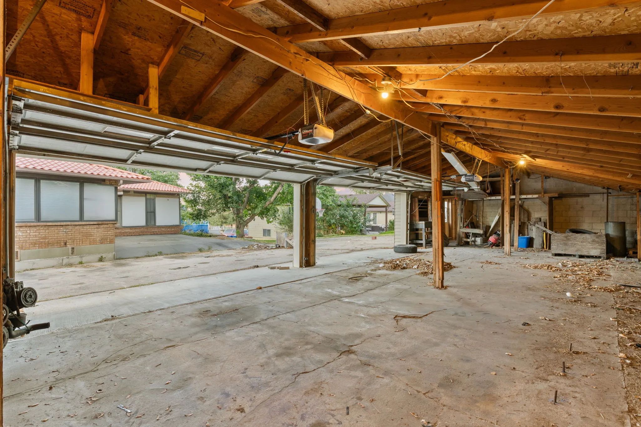 Concrete flooring with exposed wood beam ceiling and exposed structural supports