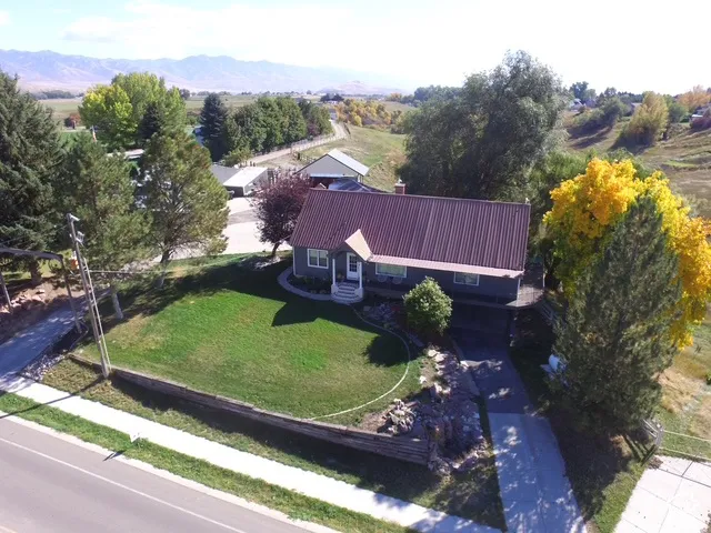Single-story residence featuring a metal roof and a covered porch