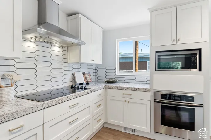 White shaker cabinetry with brushed nickel hardware