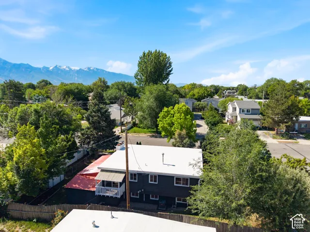 Durable roof, covered porch, and mature trees