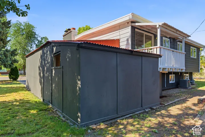 Detached shed with corrugated metal roof