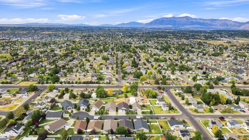 Expansive residential area with a diverse collection of homes, mature trees, and paved streets