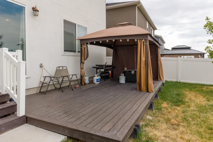 Expansive wooden deck with a privacy fence