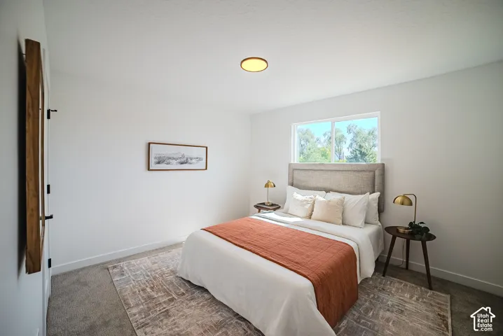 Window with exterior scenery, overhead flush-mount lighting, and wall-to-wall carpeting