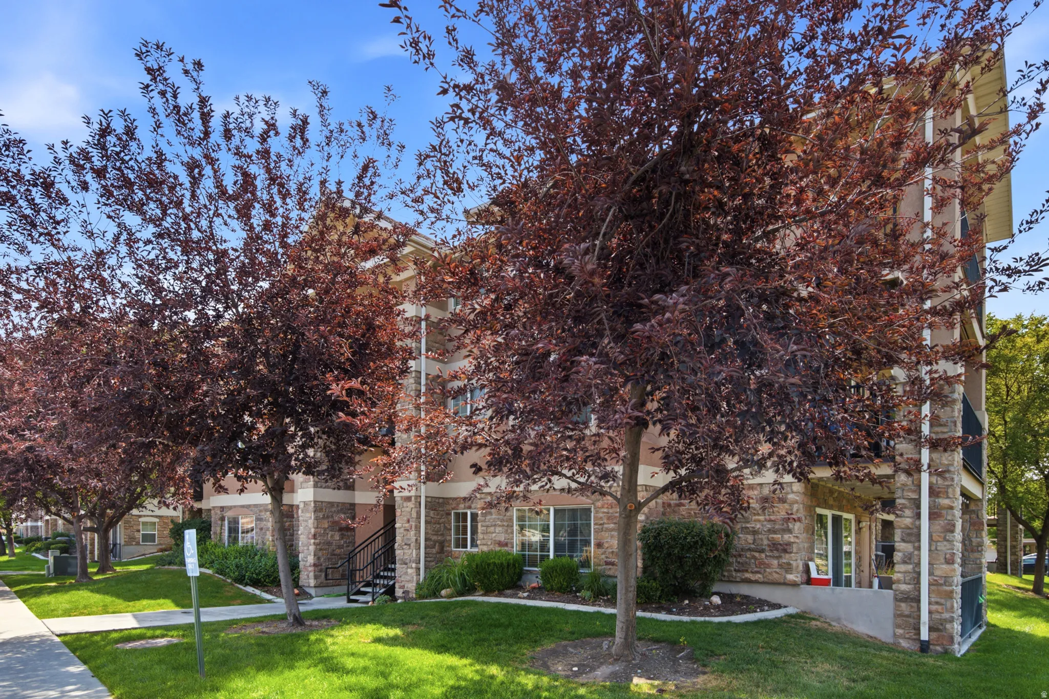 Building exterior featuring stone veneer and stucco siding